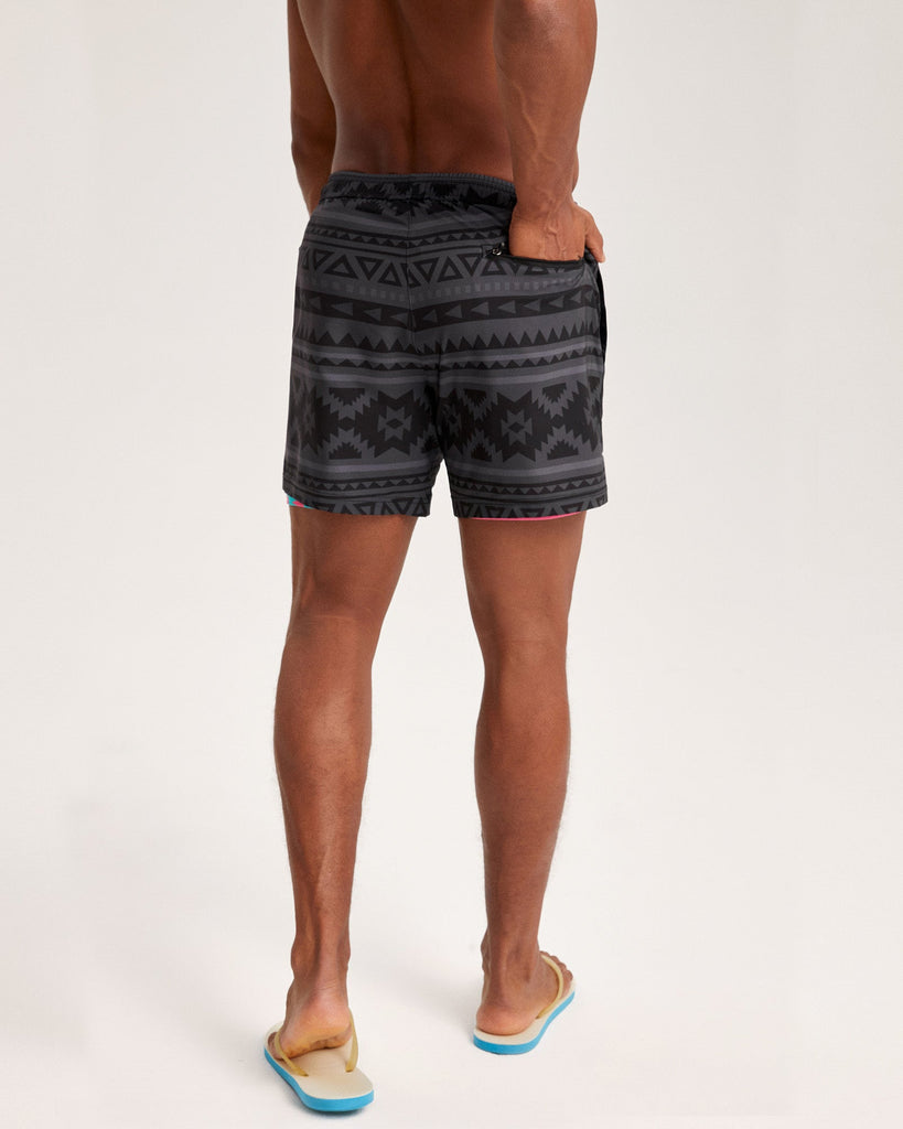 FlipFlicker Pink Geo Swim Trunks