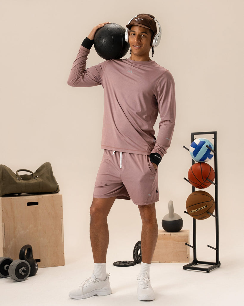 Man wearing dusty rose shorts enjoying a summer outdoor activity