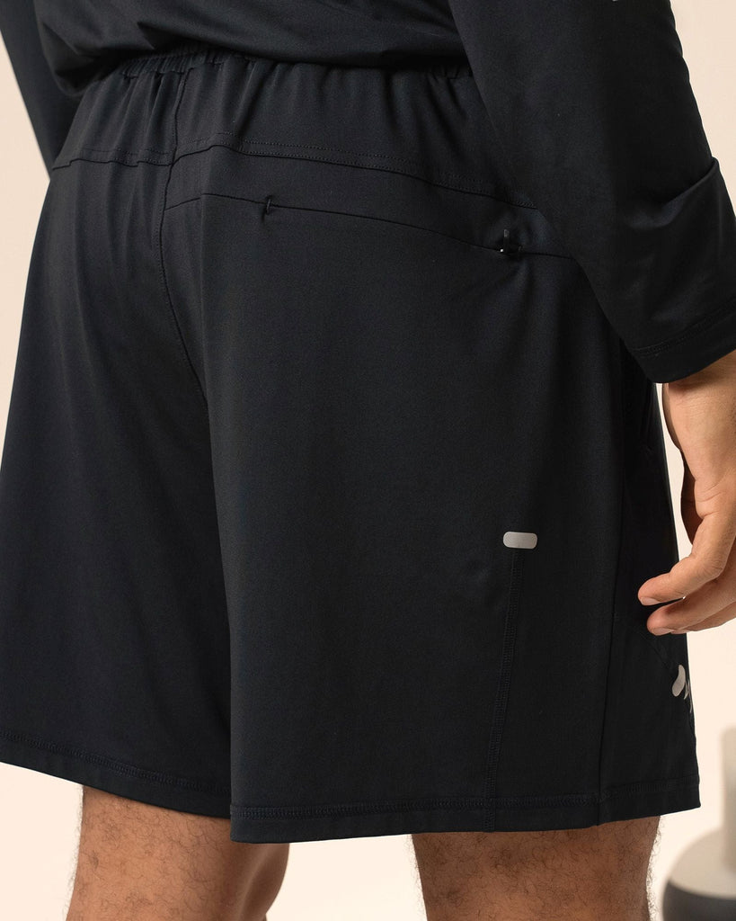 Back view showing moisture wicking material and lightweight fit of black shorts