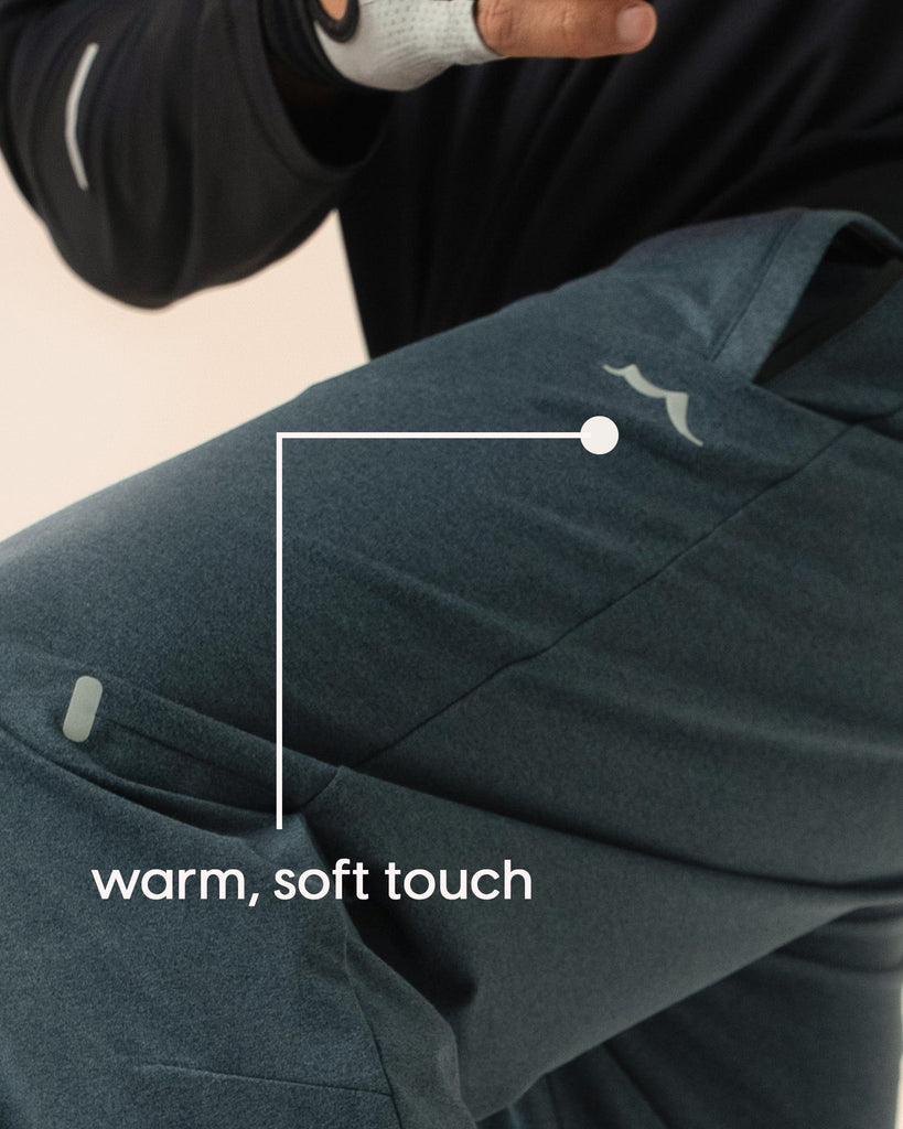 Detail of moisture wicking and wrinkle resistant fabric on navy blue joggers