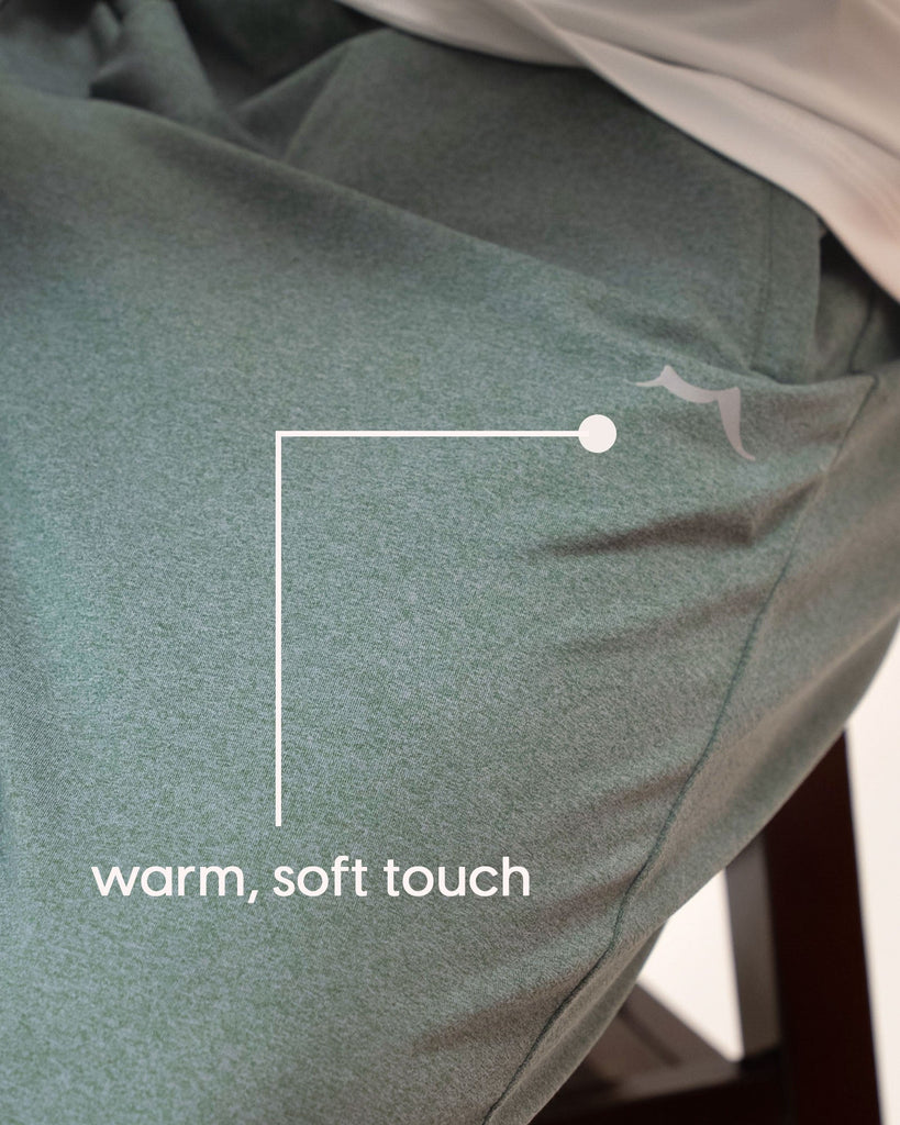 Close-up of soft touch fabric texture and drawstring on green joggers
