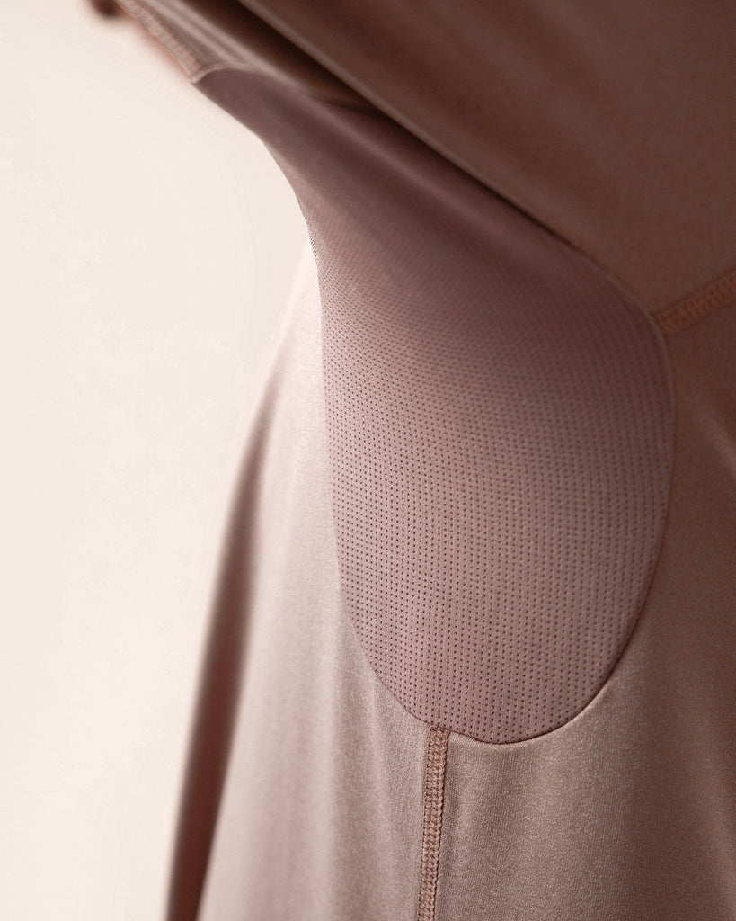 Detail of the breathable, quick-dry fabric used in dusty rose top